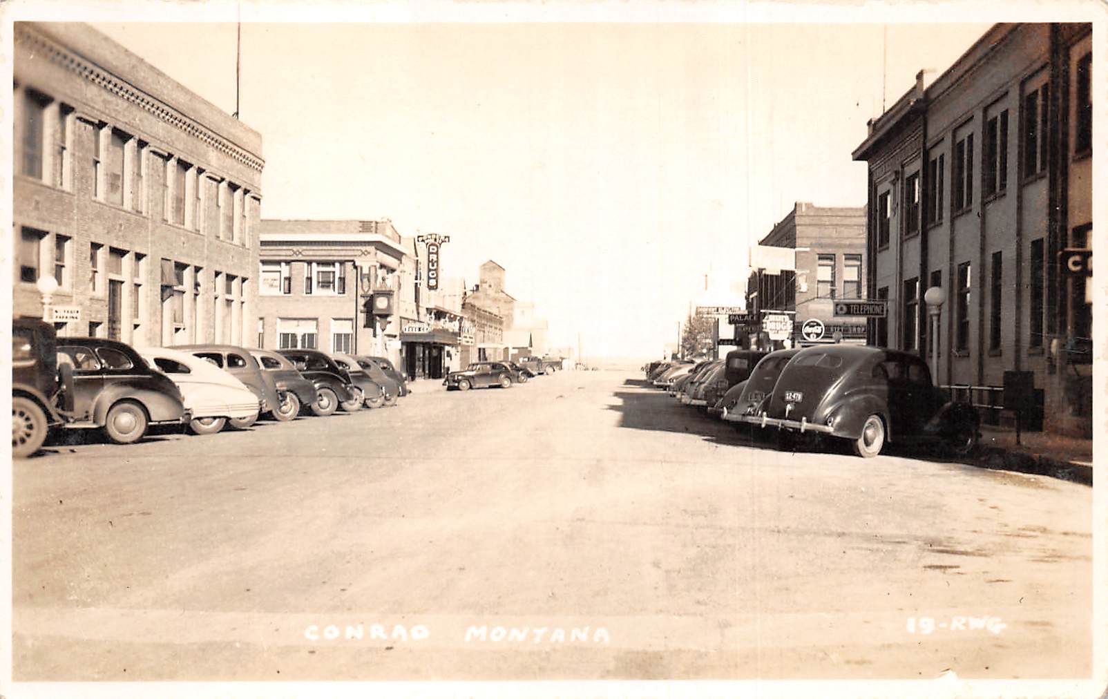 Conrad Montana Street Scene, Drug Store, Real Photo Vintage Postcard U7264